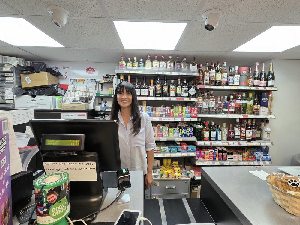 Mrs Kaur at the Post Office Counter